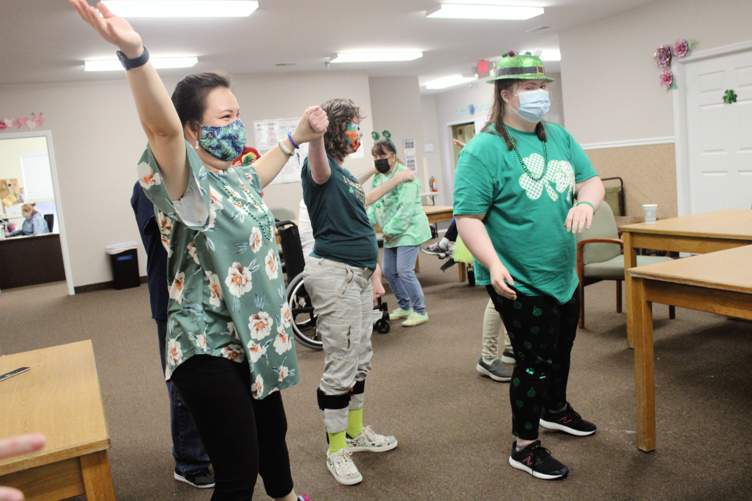 Minh and participants dancing