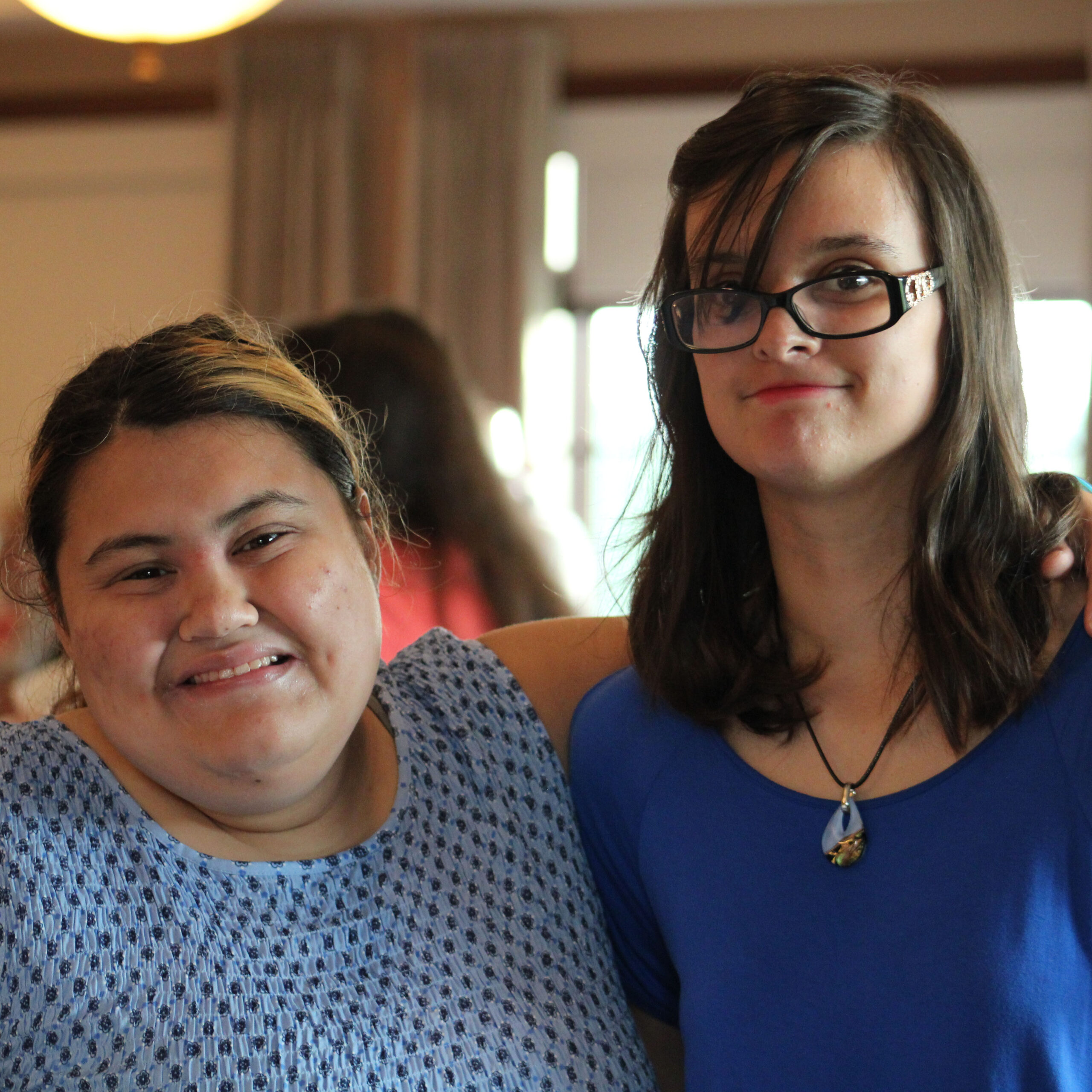 Two women smiling at the camera