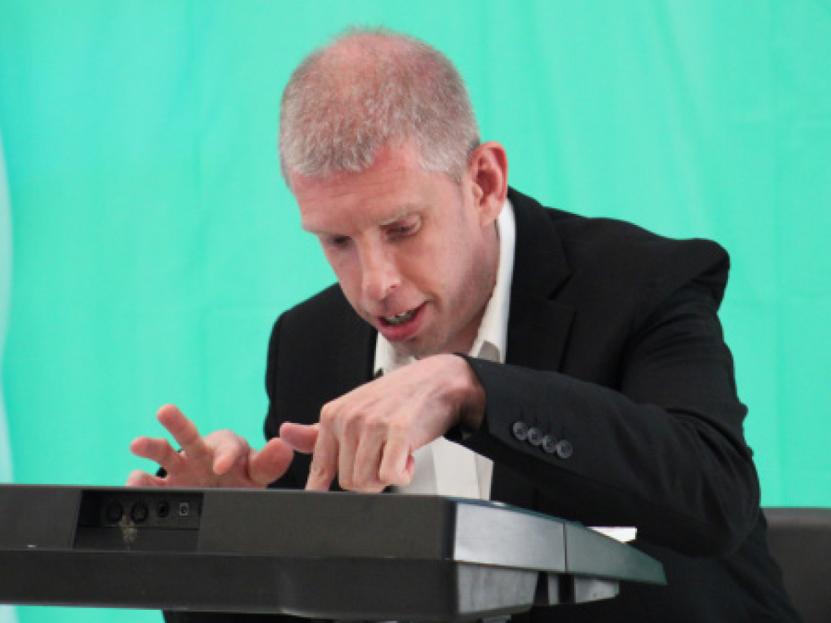 Community Living participant playing a keyboard during the Adult Recreation talent show