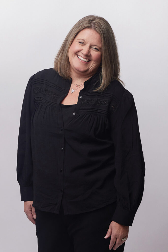 Cathi Bornhop smiling with her head tilted