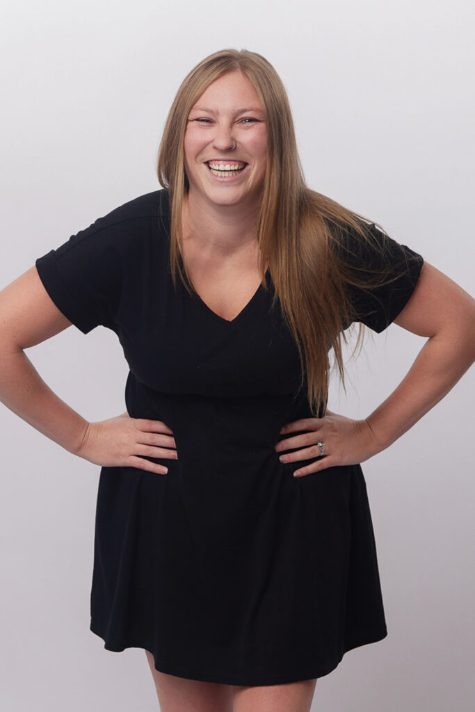 Dory Estes with her hands on her hips and smiling