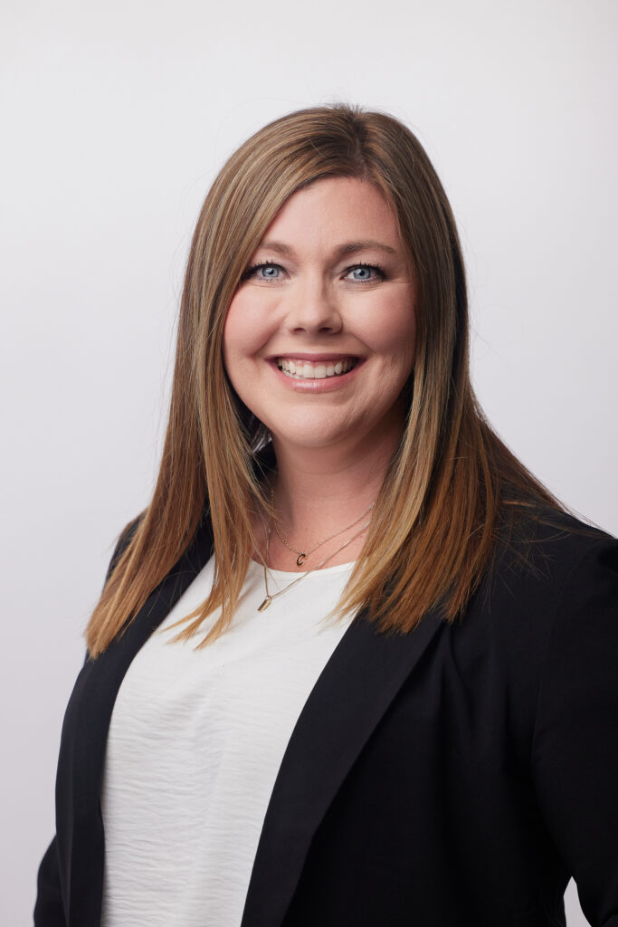 Michelle Martin-Yodis wearing a white shirt and black suit jacket