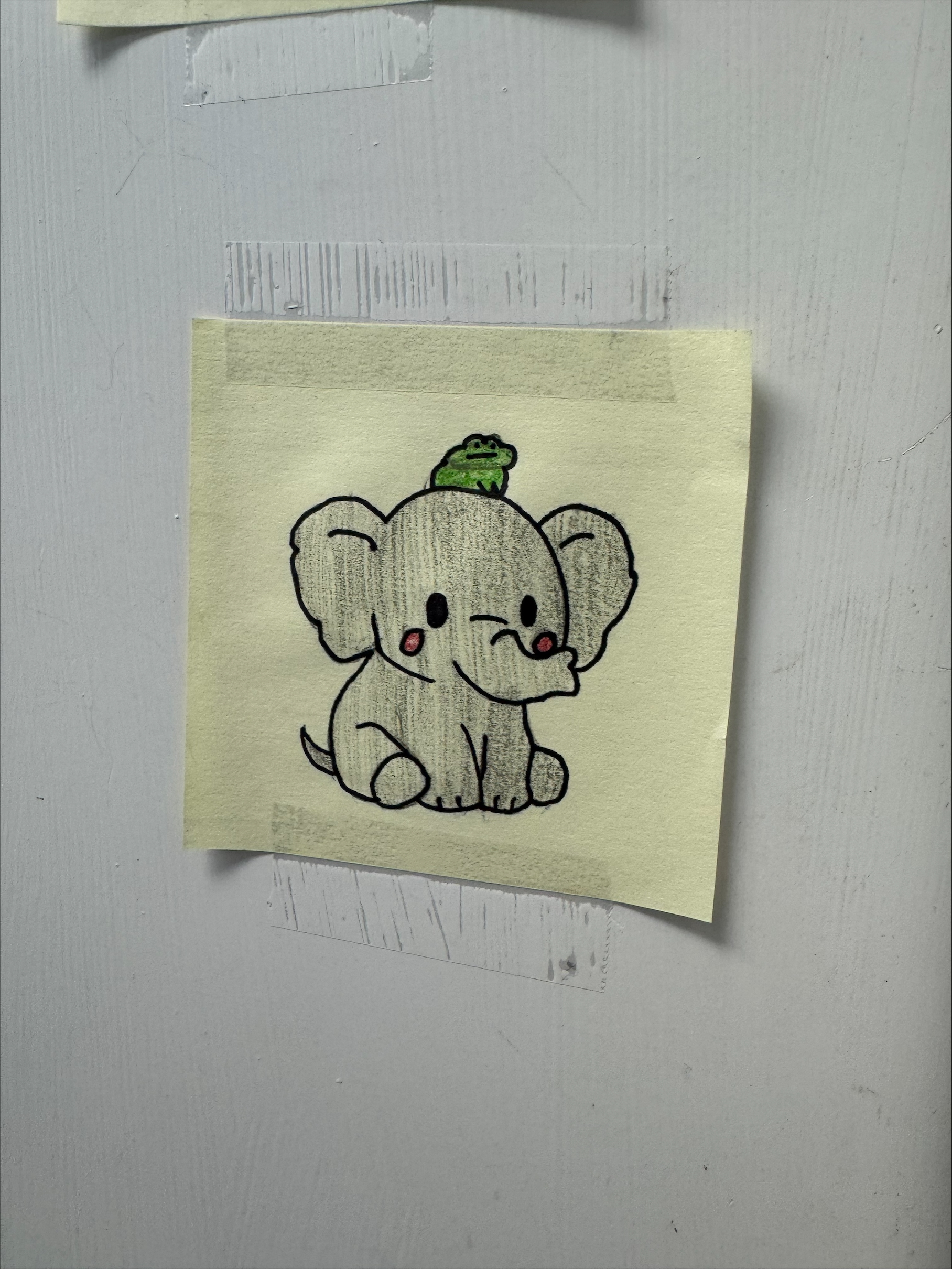 a doodle on a sticky note of a frog sitting on an elephants head