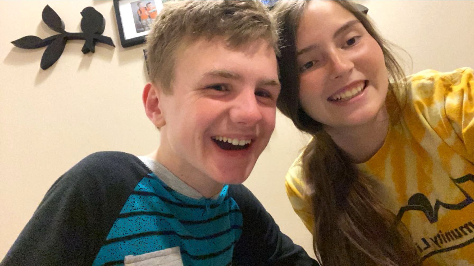 Alex and Community Living Support Staff Maddie smile together.