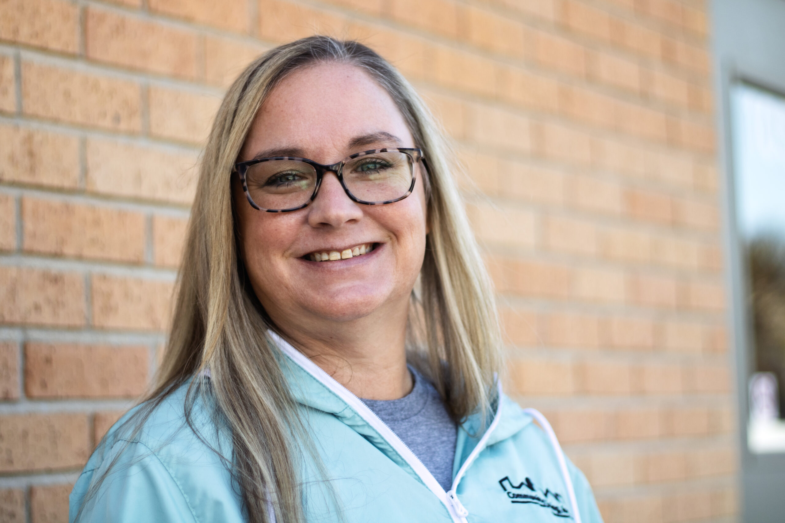 Jennifer Thomas standing outside a Community Living building