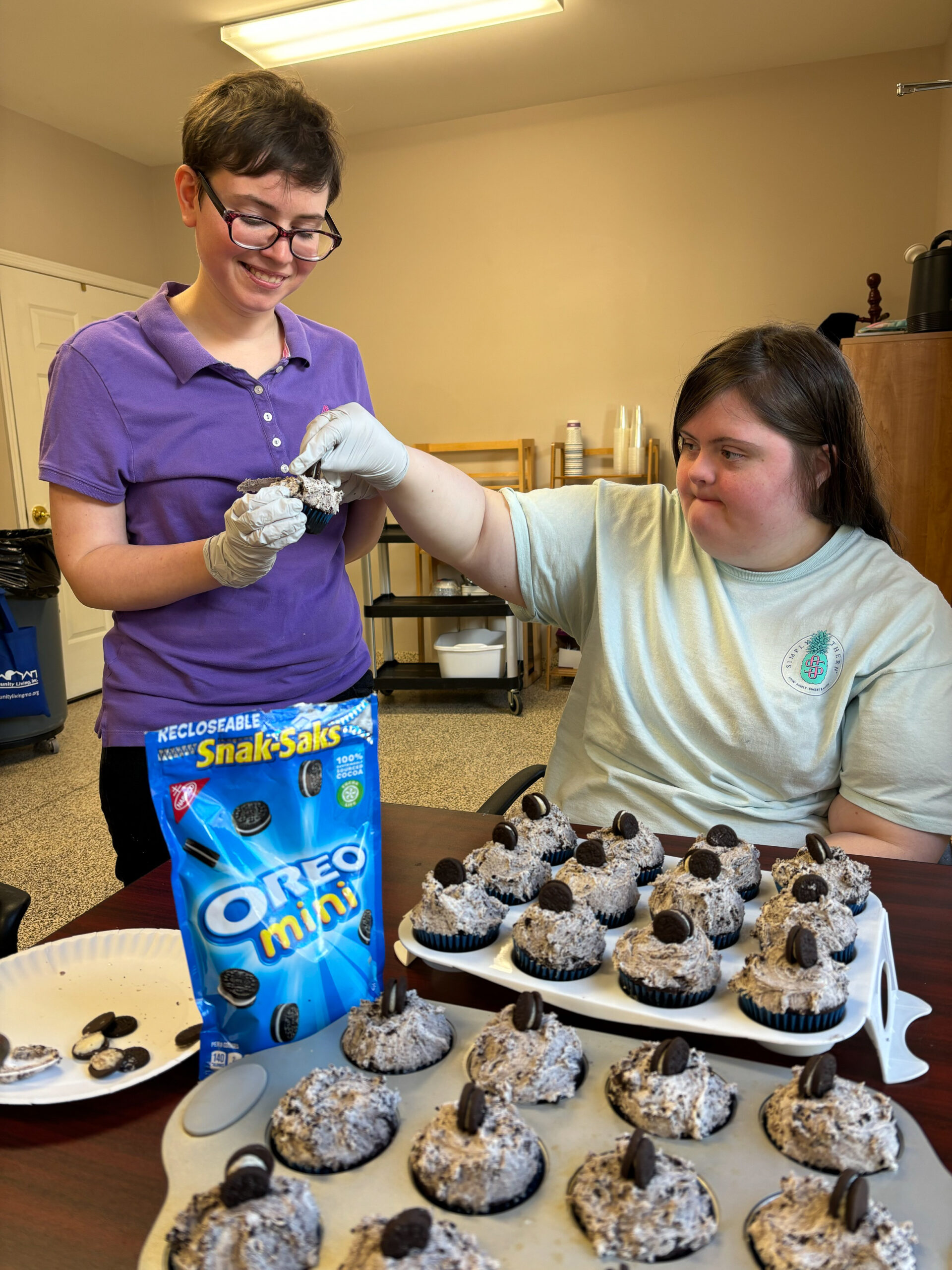Mahon participants Allison and Abby make oreo cupcakes together in the center's kitchen