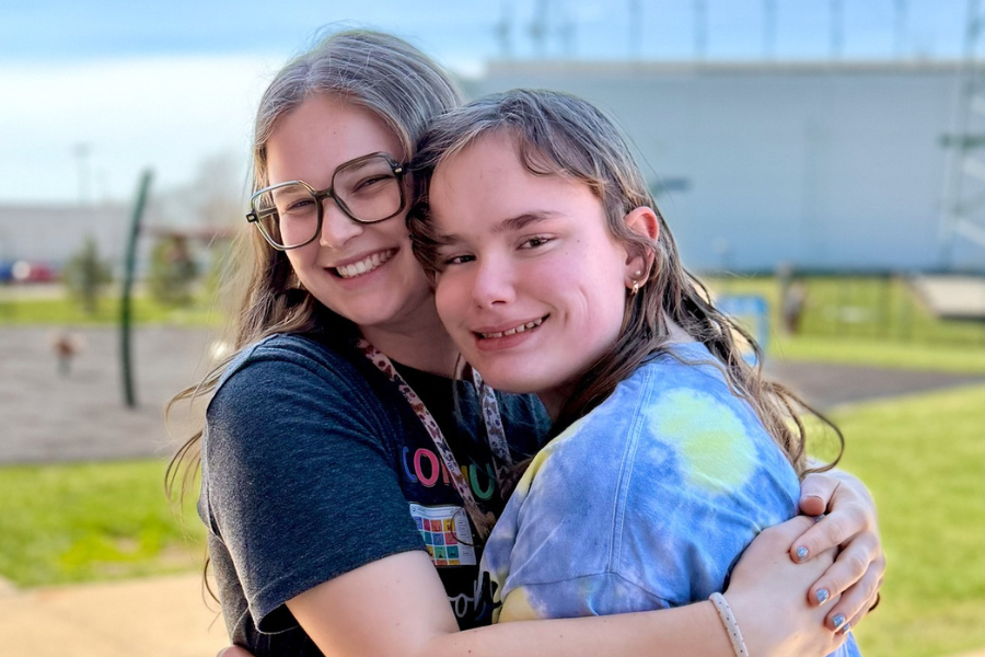Staff and SOAR participant hugging